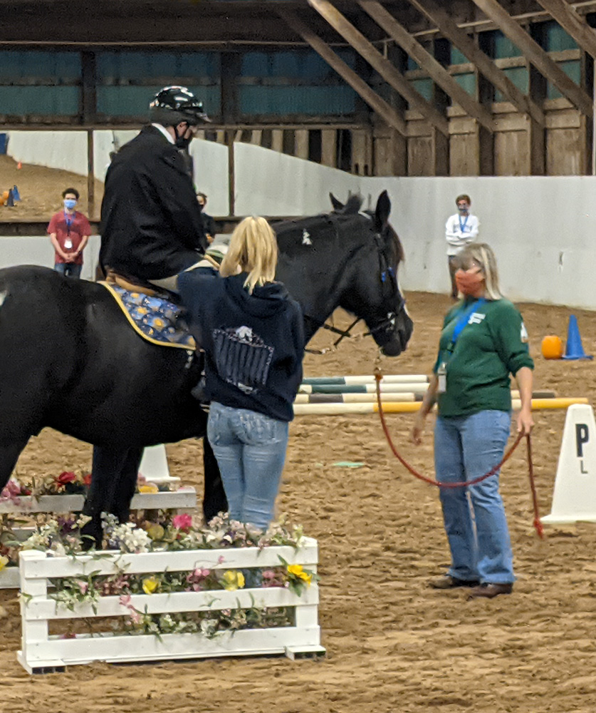 therapeutic riding program participant and volunteers