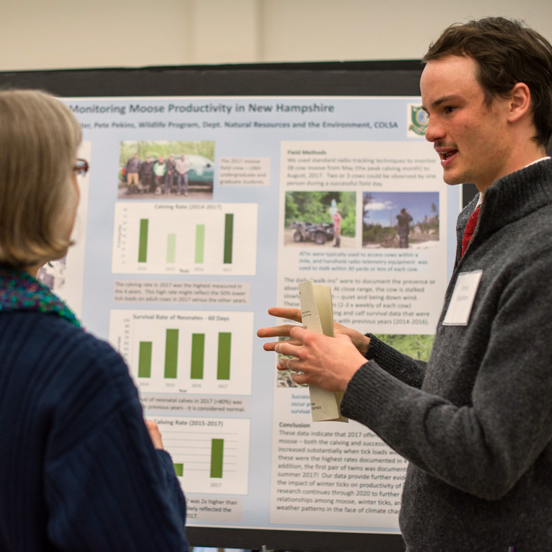 An undergraduate student shares his research at the UNH Undergraduate Research Conference.