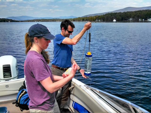 students taking water samples at a lake