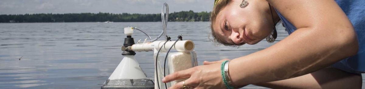 UNH student conducting a water test