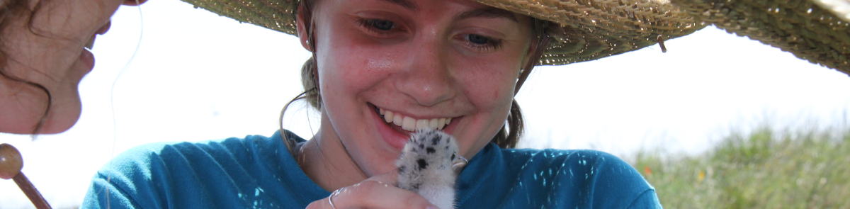 UNH Zoology student with chick