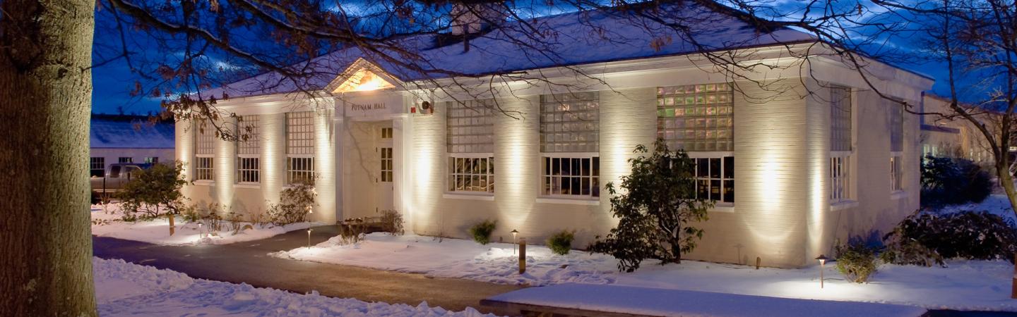 Putnam Hall at night in winter
