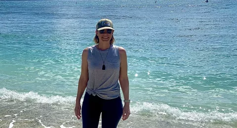 Jill Munger standing on a beach
