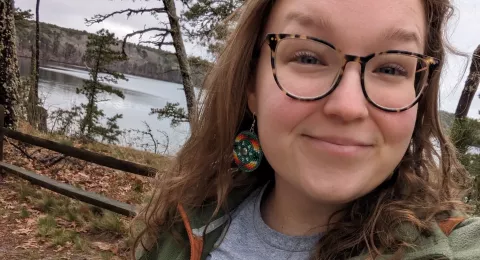 UNH graduate student Callyan Lacio by the water