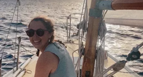 UNH graduate student Sasha Milsky on a sailboat