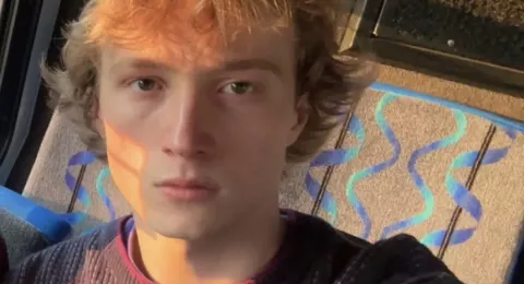 Headshot of UNH undergraduate Westley Mitchell on a UNH campus bus