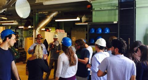 A group of students wearing hard hats on a tour of the UNH Cogen Plant.