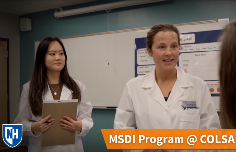 A thumbnail of two MSDI students talking to a patient