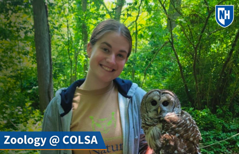 A thumbnail of a zoology student in a forest holding a barred owl