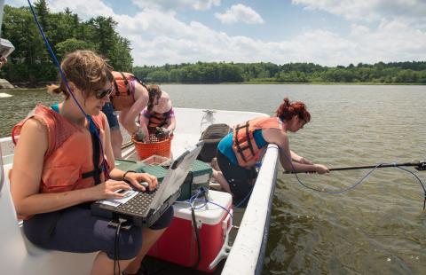 Researchers studying Vibrio bacteria in aquaculture systems to ensure food safety.