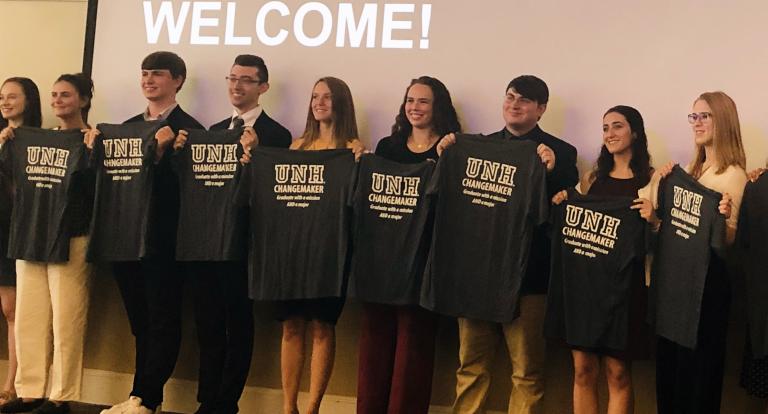 UNH social innovation interns show off their changemaker t-shirts