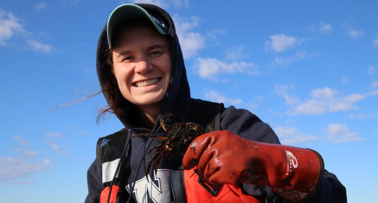 Kelsey Meyer holding green crab