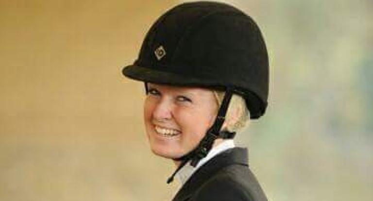 A headshot of Sian Mooney, in a riding helmet and jacket.