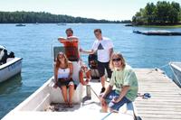 grad students in boat researching water pollution