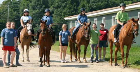 Students riding horses