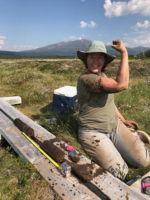 Dr. Ernakovich showing some muscle while working in the field.