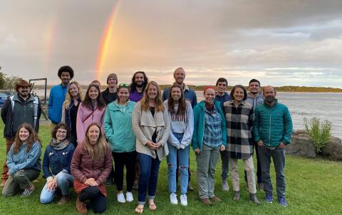 Soil BoiMe Group photo with a vibrant double rainbow in the background