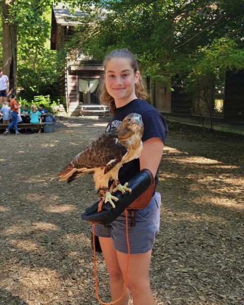 UNH student Madi Wing with a hawk