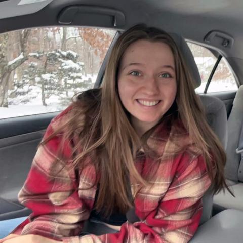 A photo of undergraduate student Jocelyn Brierley in a vehicle.
