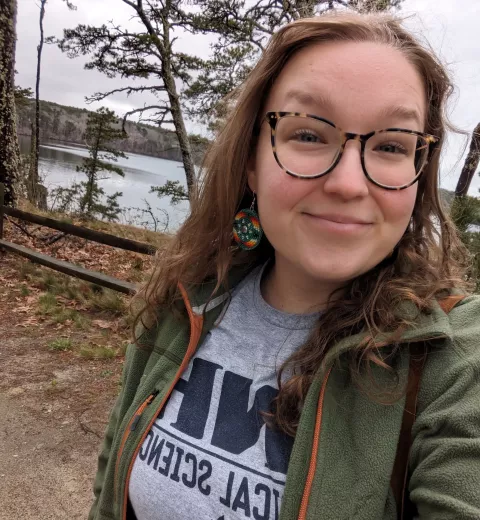 UNH graduate student Callyan Lacio by the water