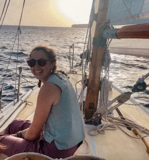 UNH graduate student Sasha Milsky on a sailboat