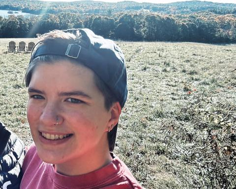 UNH wildlife and conservation biology major Mikael Skelley in a field