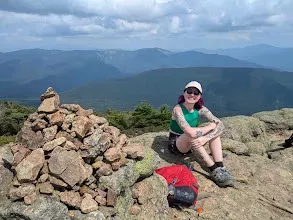 UNH doctoral student Aubrey Dissinger poses while on a hike