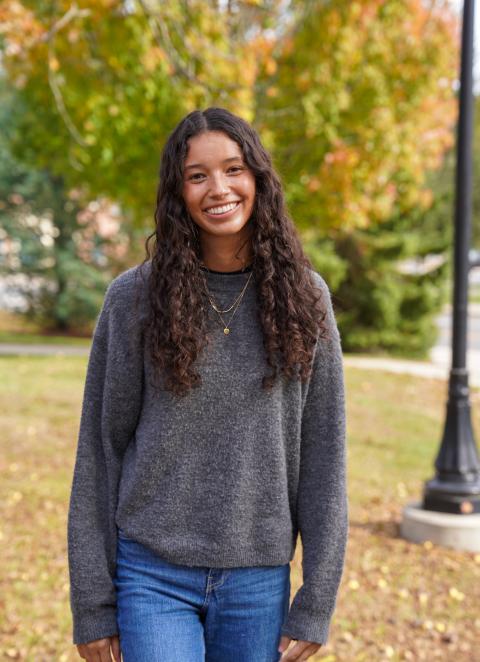 UNH undergrad Lina Deaza-Roed poses outside in the fall on the UNH campus