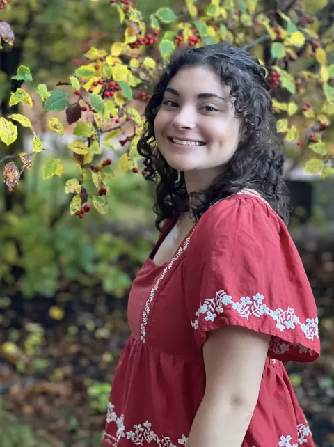 UNH undergrad Nia Lessard poses under a tree