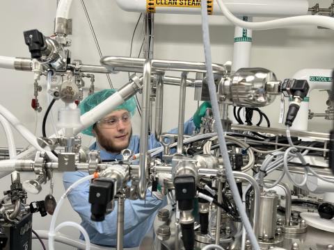 UNH graduate student Nicholas Zylinski at work identifying abnormalities as part of the pharmaceutical manufacturing process