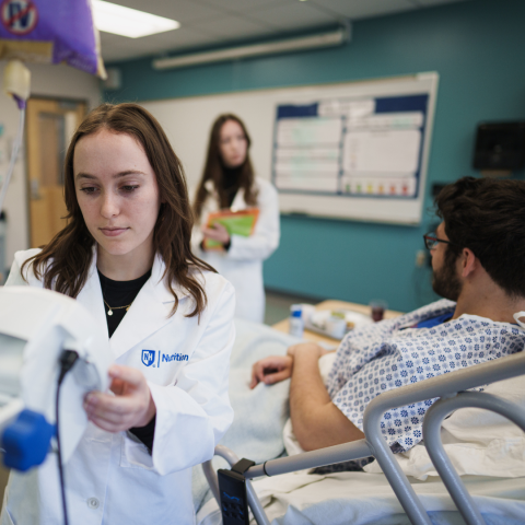 UNH students at a Nutrition Simulation Lab