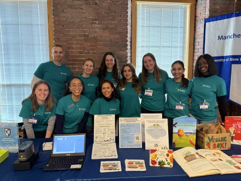 The MENA research group at a community event.
