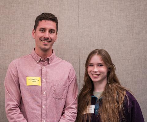 UNH alum and current student pose together during a STEM Mentorship dinner