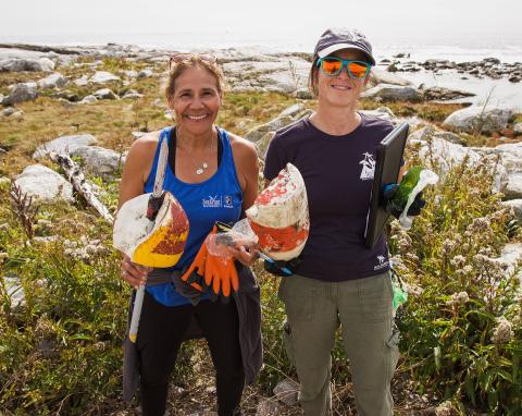 Two Extension staff members engaged in coastal protection projects