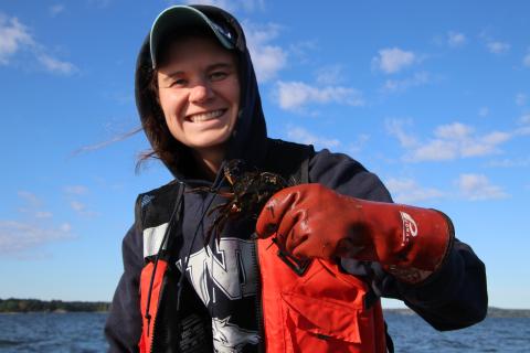 Kelsey Meyer holding green crab