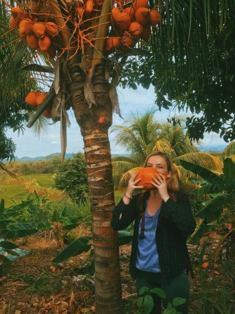 Taylor Zupo drinks fresh coconut water in Peru. Taylor Zupo drinks fresh coconut water in Peru.