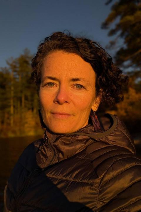 UNH lecturer Jess Gerrior headshot taken outside during sunset